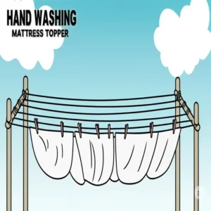A mattress topper drying on a clothesline outdoors, highlighting proper drying techniques after washing a mattress topper.