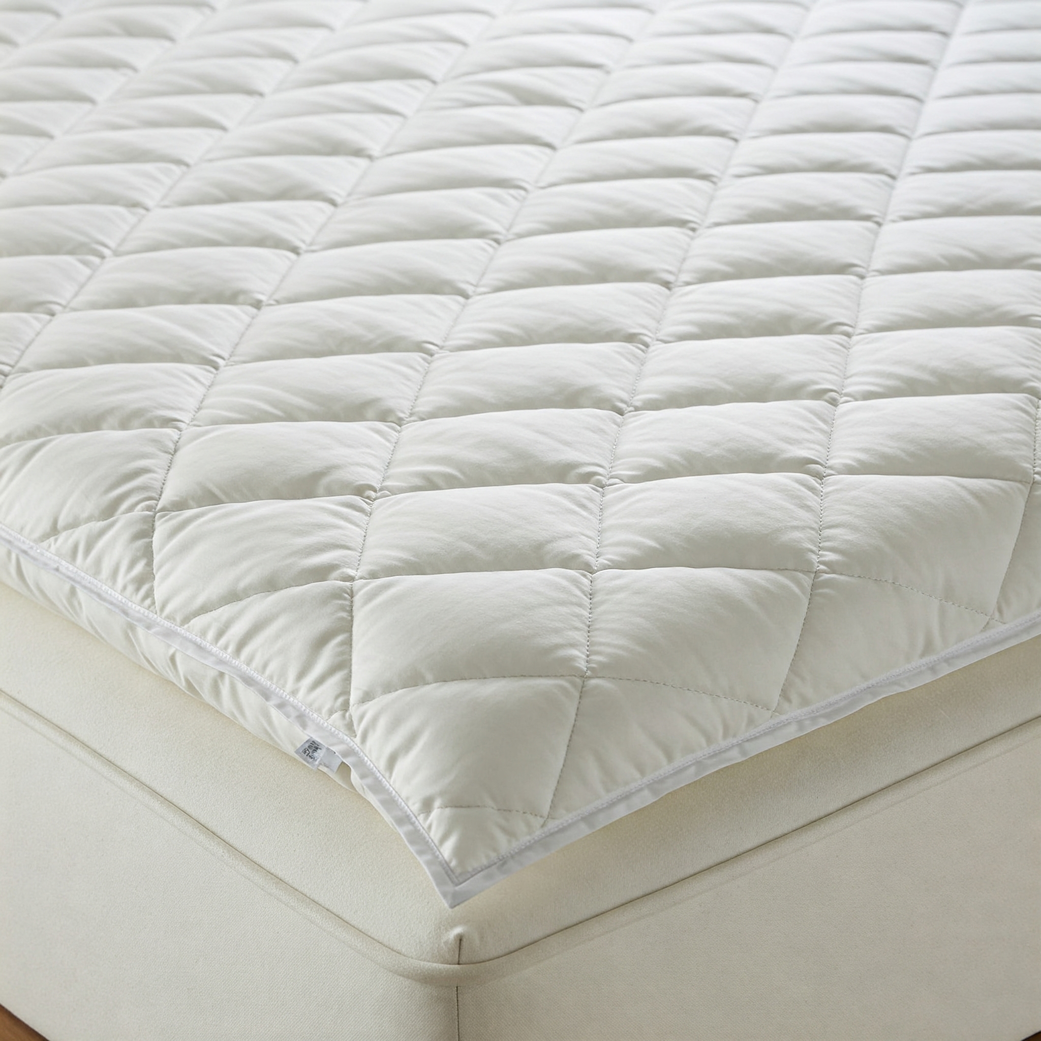 Goose down mattress topper, luxurious and providing extra comfort and support for a restful night's sleep.