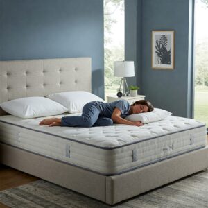 Person sleeping soundly on spacious full xl mattresses.