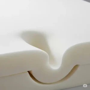 Close-up of high-density memory foam material, demonstrating the conforming support offered by the best mattress topper for hip pain.