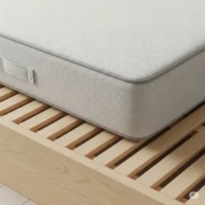Close-up view of a supportive mattress for a platform bed, resting directly on the wooden slats.