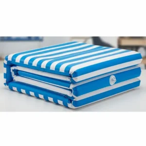 A deflated inflatable pool mattress folded neatly for easy storage and travel.