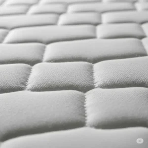 A close-up view of the breathable and soft fabric cover of a 66x80 mattress.
