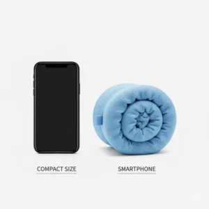 Comparison showing the small, folded cooling travel pillow compact size next to a phone.