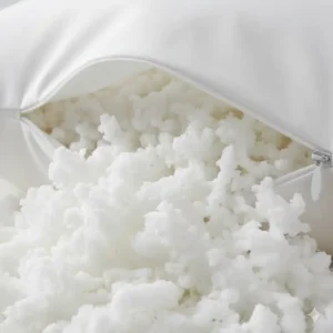 Close-up of the fluffy white filling inside the shredded memory foam pillow adjustable loft. 