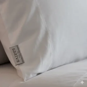 Close-up texture of the breathable, organic cotton sateen cover found on the Saatva pillow luxury option.