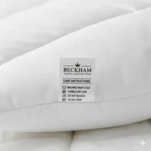 Detail of the care tag, confirming the machine-washable nature of the product, important information for Beckham Hotel Collection pillow reviews.